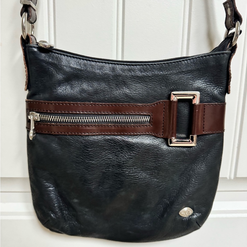 The Trend Black and Brown Leather Crossbody Bag. 9.5” by 9.5” by 0.5”